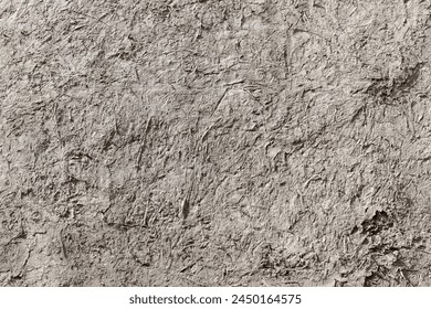 Ancient gray adobe wall, close up background photo texture