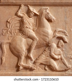 Ancient Greek bas-relief on grave stele depicting battle scene between a rider, the deceased, and a fallen hoplite, a heavily armed foot soldier of ancient Greece.