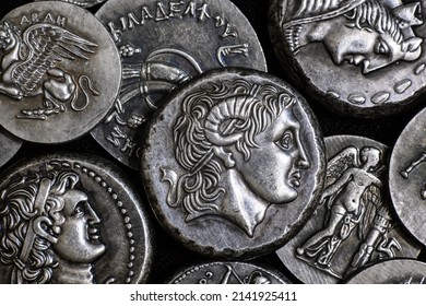 Ancient Greek Coin With Alexander The Great Portrait, Pile Of Silver Tetradrachm Coins. Top View Of Old Rare Money. Concept Of Greece, Valuable Coins Collection, Ancient History And Treasure.