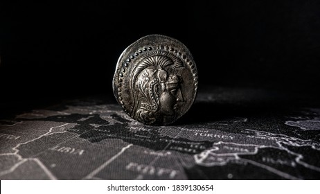 Ancient Greek Coin On Black Map, Selective Focus