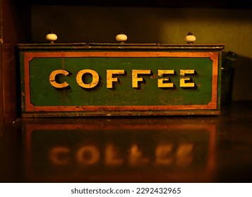 Ancient green box for coffee. Reflection.