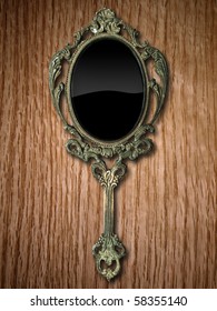 Ancient Hand Mirror On Red Oak Wood