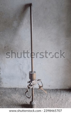An ancient hanging scale made from golden copper