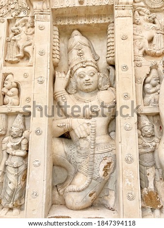 Ancient historical sandstone carvings in the wall of Kanchi Kailasanathar temple in Kanchipuram, Tamilnadu. Bas relief sandstone carvings of Hindu God & Animal sculpture in temple walls.
