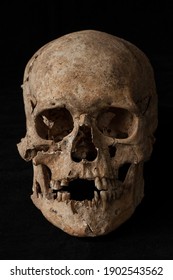 Ancient Human Skull On Black Background