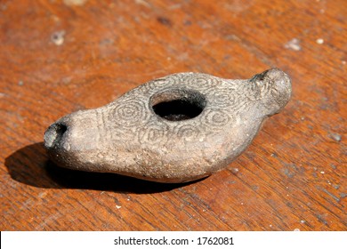 An Ancient Jewish Oil Lamp Artifact.