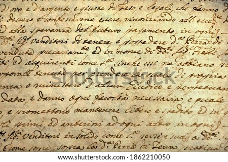 Ancient manuscript of 1700 century written in ink and goose pen in Italian. Antique letter with handwritten text. Stained texture background. Vintage style toned picture 