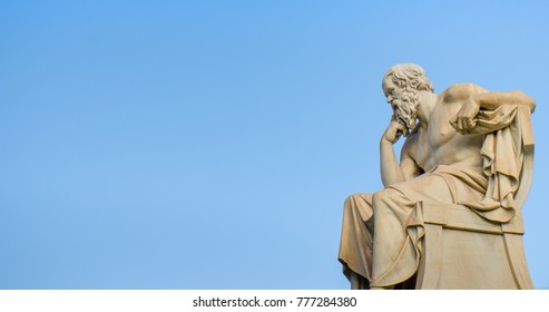 Ancient marble statue of the great Greek philosopher Socrates on background the blue sky.  - Powered by Shutterstock