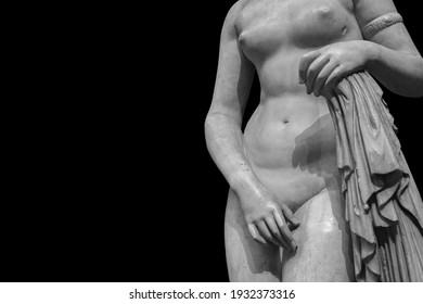 Ancient marble statue of a nude woman. Antique naked female sculpture. Sculpture isolated on black background