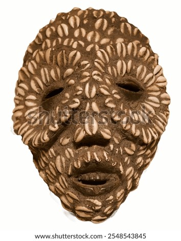 an ancient mask made of shells isolated on a white background