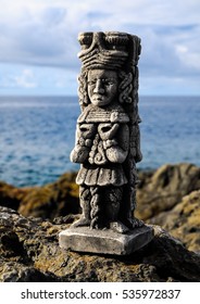 Ancient Maya Statue on the Rocks near Ocean