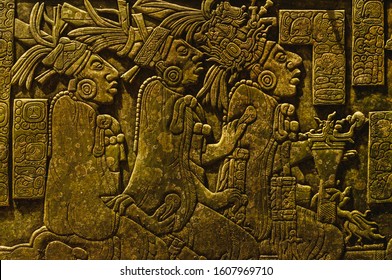 Ancient Mayan drawings carved on the stone wall