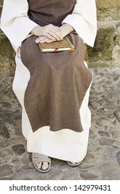 Ancient Medieval Nun Habit And Book In His Hands, Religion