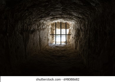 ancient medieval prison window from the inside