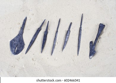 Ancient Medieval Rusty Arrowheads - Archaeological Artifact In The Sand