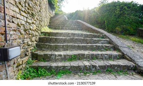 ancient medieval stone staircase with stone wall. High quality photo
