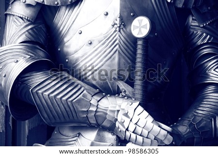 Ancient metal armor in sepia.