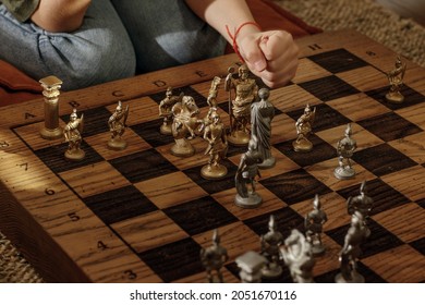 Ancient Metal Roman Chess Set With Silver And Gold Plated Pieces On Solid Oak Wood Board. Concept Image For Business Strategy, Competition, Relaxation, Recreation And Mental Agility.