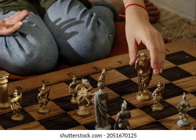 Ancient Metal Roman Chess Set With Silver And Gold Plated Pieces On Solid Oak Wood Board. Concept Image For Business Strategy, Competition, Relaxation, Recreation And Mental Agility.