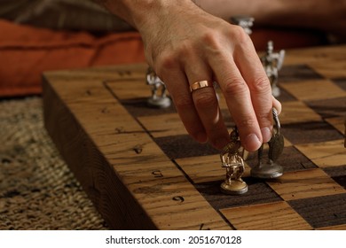 Ancient Metal Roman Chess Set With Silver And Gold Plated Pieces On Solid Oak Wood Board. Concept Image For Business Strategy, Competition, Relaxation, Recreation And Mental Agility.