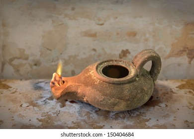 Ancient Middle Eastern Oil Lamp On Grunge Table