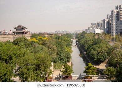 Ancient Moat Around Reconstructed City Wall Seperating Old And Modern Xi'an, Shaanxi Providence, China.