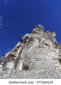 Ancient monastery inside white old rock