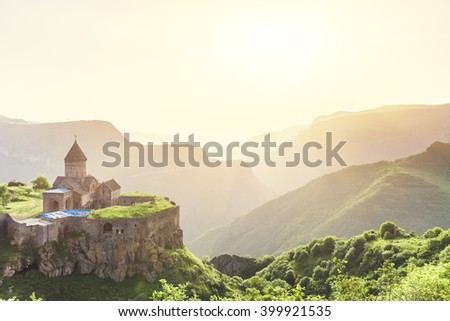 Ancient monastery in setting sun. Tatev. Armenia