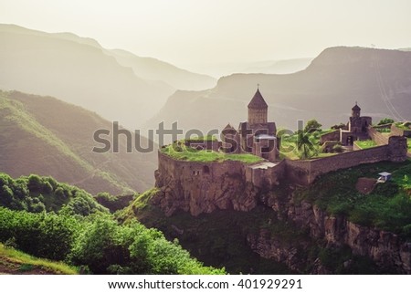 Ancient monastery in setting sun. Tatev. Armenia