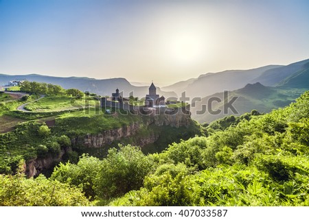 Ancient monastery in setting sun. Tatev. Armenia