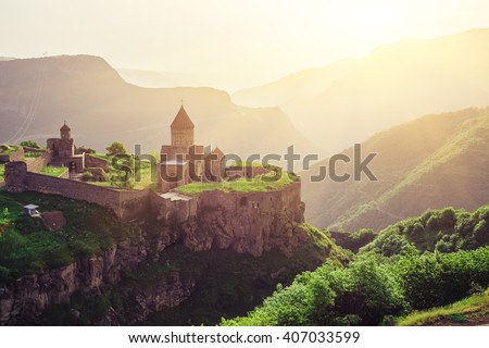 Ancient monastery in setting sun. Tatev. Armenia