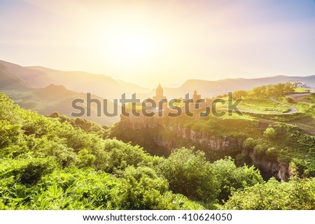 Ancient monastery in setting sun. Tatev. Armenia