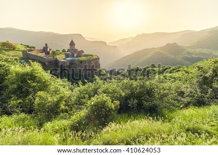 Ancient monastery in setting sun. Tatev. Armenia