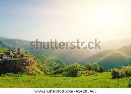 Ancient monastery in setting sun. Tatev. Armenia