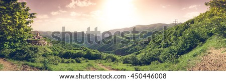 Ancient monastery in setting sun. Tatev. Armenia