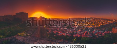Ancient monastery in setting sun. Tatev. Armenia
