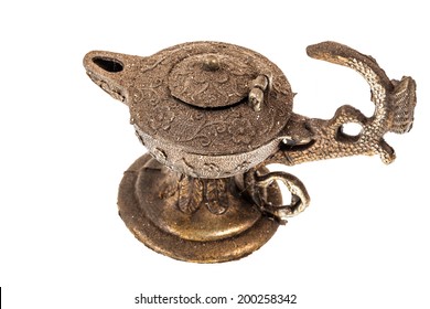 An Ancient Oil Lamp Isolated Over A White Background