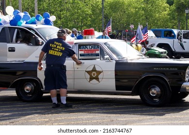 Ancient old  emergency cars vehicles tractor in Memorial Day Celebration parade US flags balloons fire truck police car Sheriff political candidates in small town May 30 2022 Grayslake IL