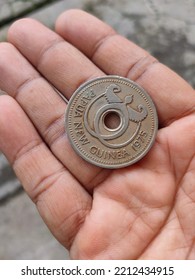 Ancient Old Papua New Guinea Coin On My Hand  At Noon