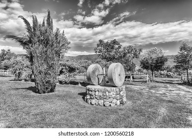 Ancient Olive Press With Two Millstones In The Countryside