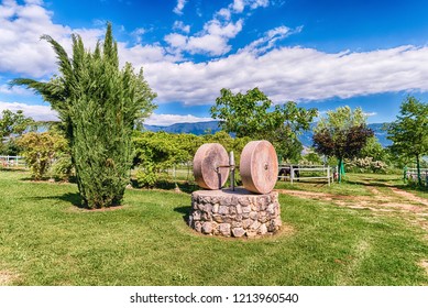 Ancient Olive Press With Two Millstones In The Countryside