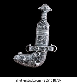 An ancient Omani dagger made of silver used by Omani men in their traditional dress - Shutterstock ID 2154318787
