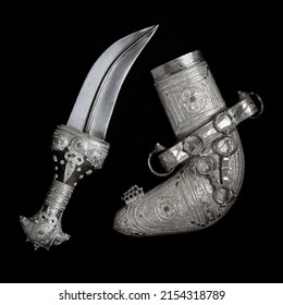 An ancient Omani dagger made of silver used by Omani men in their traditional dress - Shutterstock ID 2154318789