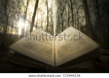 ancient open book with magic light