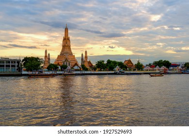 Ancient Pagoda of Wat Arun after renovation.The most beautiful historical site.view from Chao Phraya River side from Bangkok.With long exposure photography created smooth surface on the river
