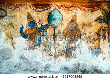 Ancient paintings of God, People idols drafted on the walls of historical Brihadeeswarar temple in Thanjavur, Tamilnadu. Fresco, mural paintings. Unique Thanjavur paintings on the walls.