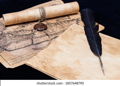 An ancient paper scroll sealed with a seal. Old map. Blank sheet of paper, pen for writing.