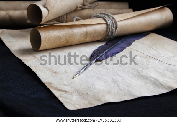 Ancient paper scrolls sealed with a seal on an\
old map. Pen for\
writing.