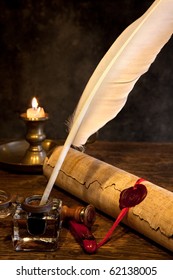 Ancient parchment or diploma scroll with wax seal and quill pen
