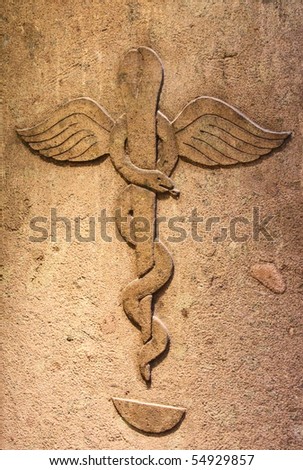 Ancient pharmacy with the symbol of medical caduceus